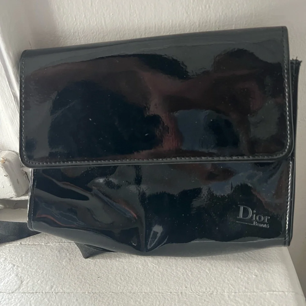 Dior Glossy Black Makeup Bag with Ribbon Detail.